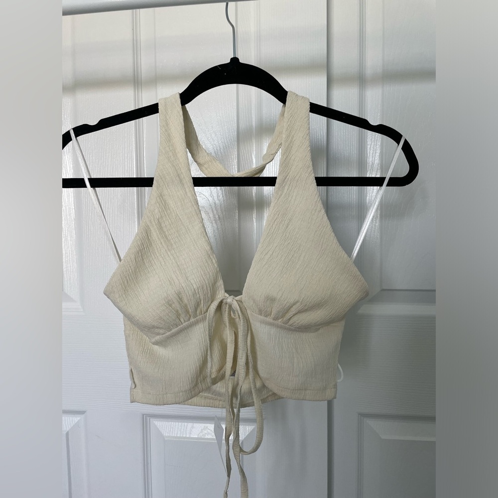 New halter top from urban outfitters in a cream color and size small.